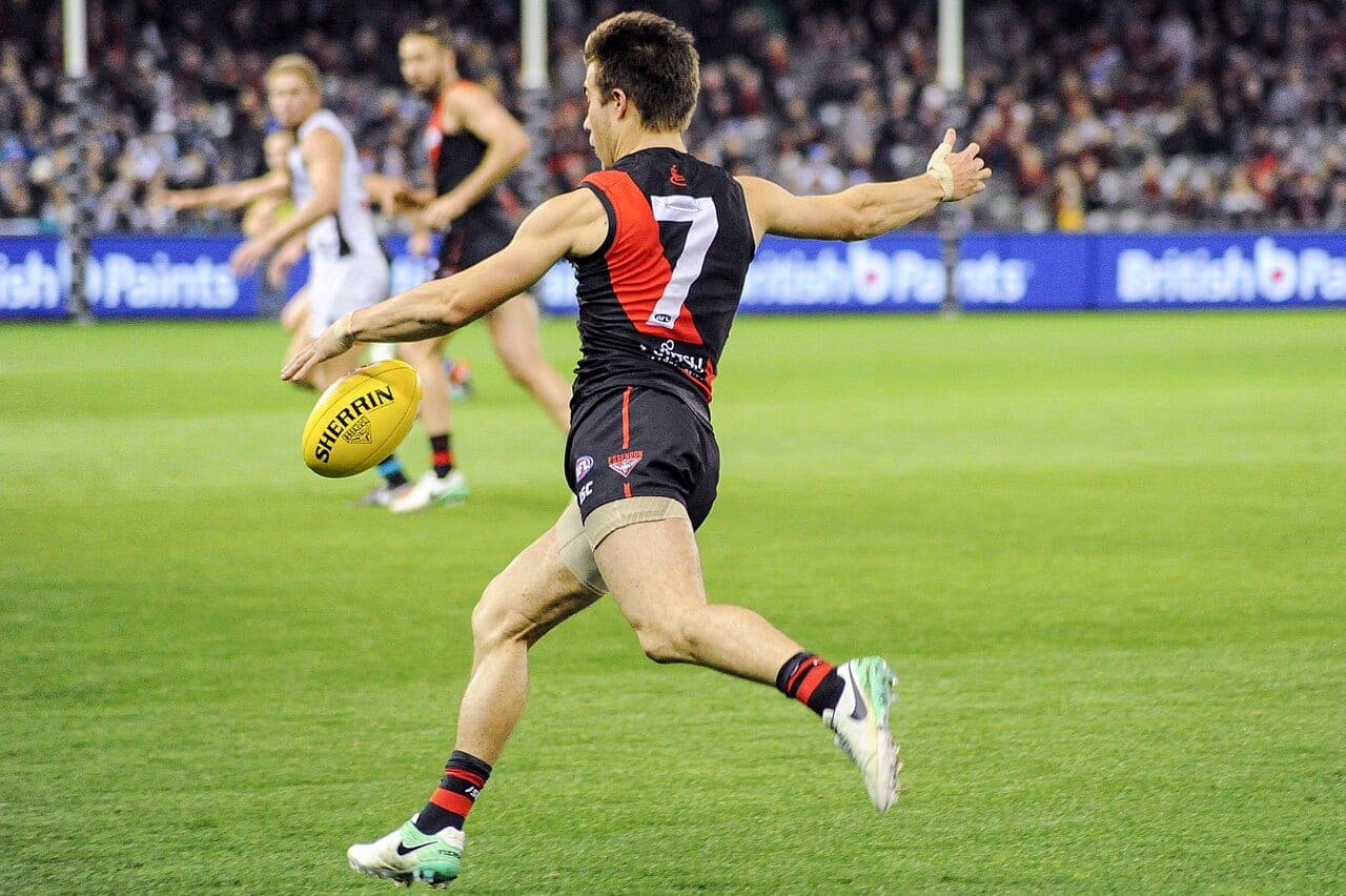 Zach Merrett kicks for Essendon during a match in 2017, before his trade to Hawthorn this week (file photo).